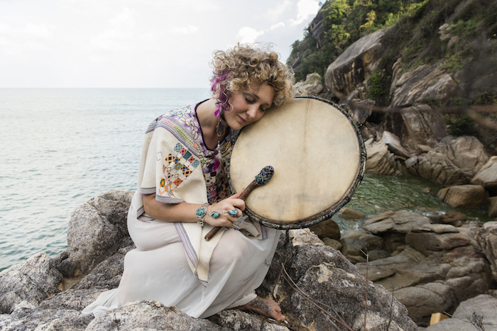 Guinevere Short with her shamanic drum photographed in Thailand, 2014 featured on Thenuminous.net